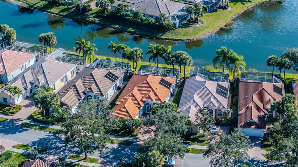 3766 Whidbey Way Naples, FL 34119 - Photo 4 of 50 Aerial perspective of suburban area with a nearby body of water