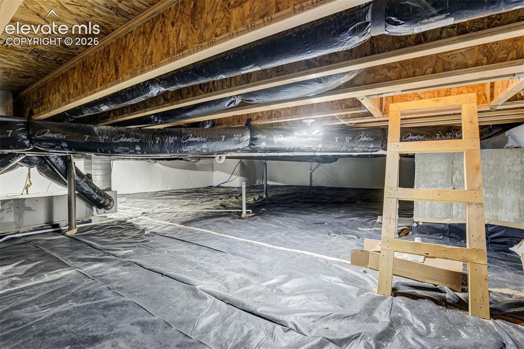 11321 Method Point Peyton, CO 80831 - Photo 26 of 47 Crawl space with ladder