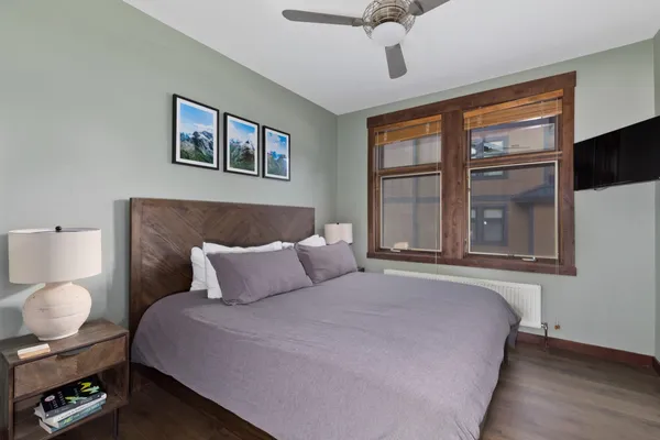 a bedroom with bed and window