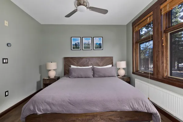 a bedroom with a large bed and a window