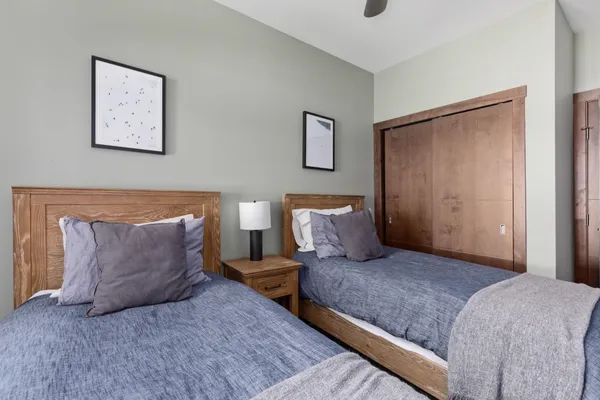 a bedroom with a large bed and a couch