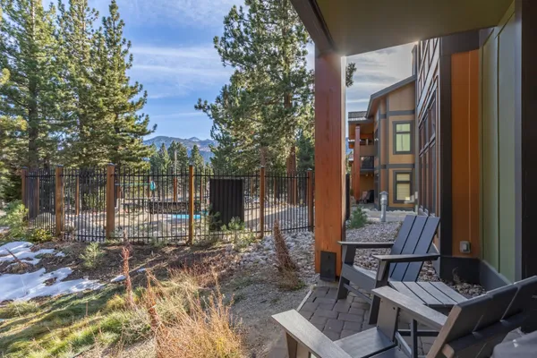 a backyard of a house with outdoor seating