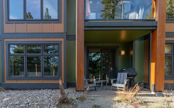 a front view of a house with outdoor seating