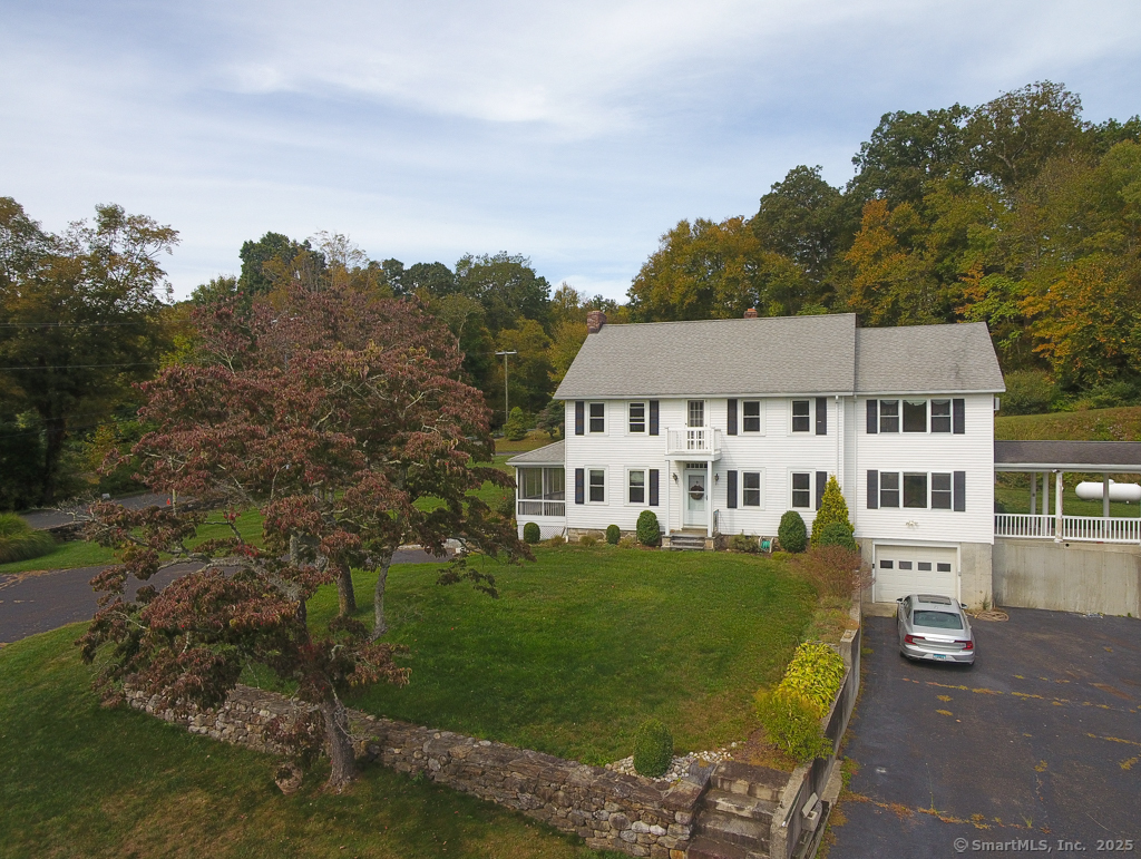 124 Purchase Brook Road Southbury, CT 06488 - Photo 1 of 26 a view of a big house with a big yard and large trees