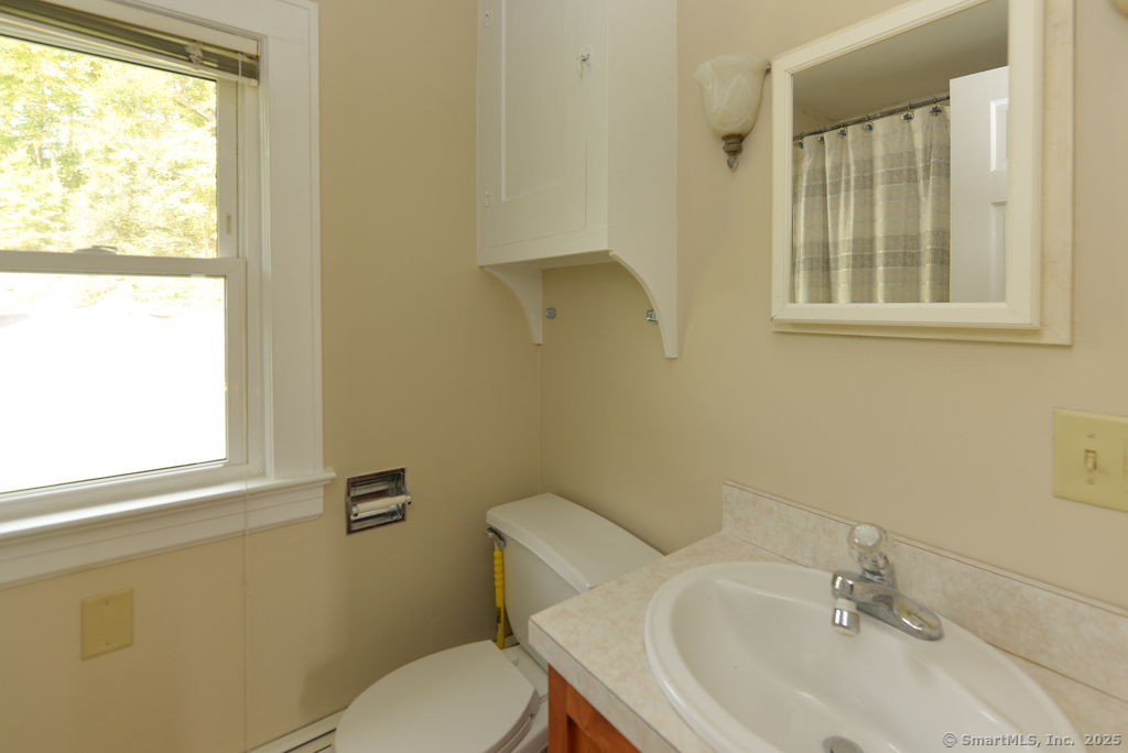 124 Purchase Brook Road Southbury, CT 06488 - Photo 13 of 26 a bathroom with a sink and a toilet