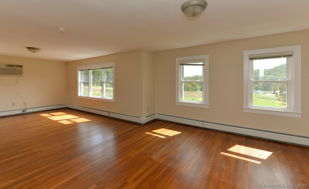 124 Purchase Brook Road Southbury, CT 06488 - Photo 16 of 26 a view of livingroom with hardwood floor and window
