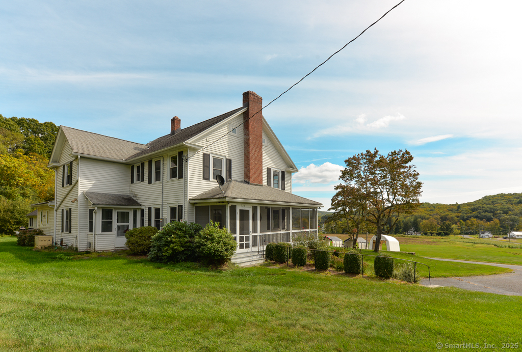 124 Purchase Brook Road Southbury, CT 06488 - Photo 20 of 26 a front view of a house with a yard