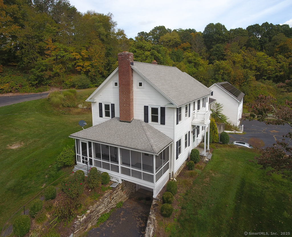 124 Purchase Brook Road Southbury, CT 06488 - Photo 26 of 26 a aerial view of a house next to a big yard and large trees