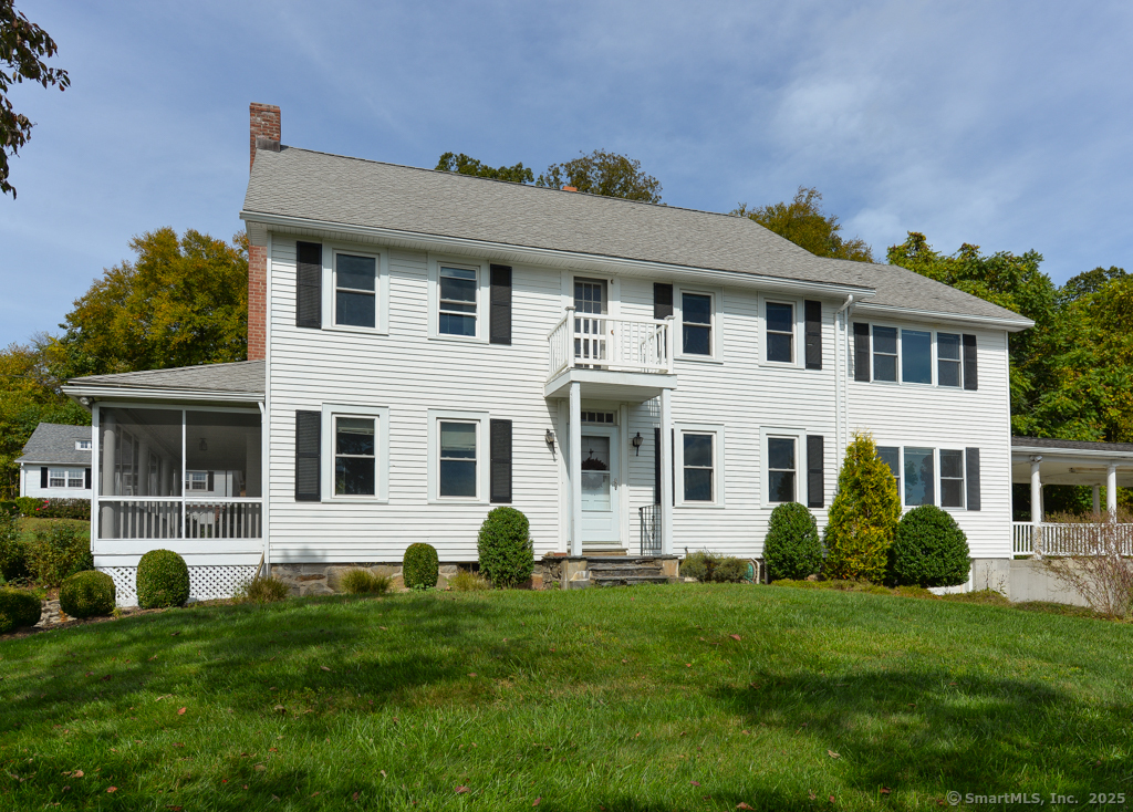 124 Purchase Brook Road Southbury, CT 06488 - Photo 3 of 26 a front view of a house with a yard