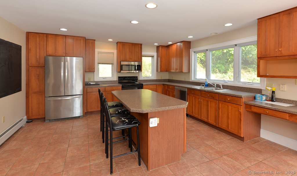 124 Purchase Brook Road Southbury, CT 06488 - Photo 10 of 26 a kitchen with stainless steel appliances granite countertop a stove a sink a refrigerator and a refrigerator