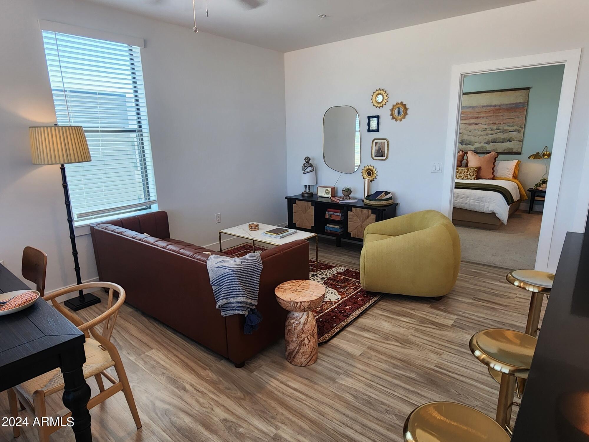 1727 East Pecos Road, Unit B4 Gilbert, AZ 85295 - Photo 2 of 6 a living room with furniture