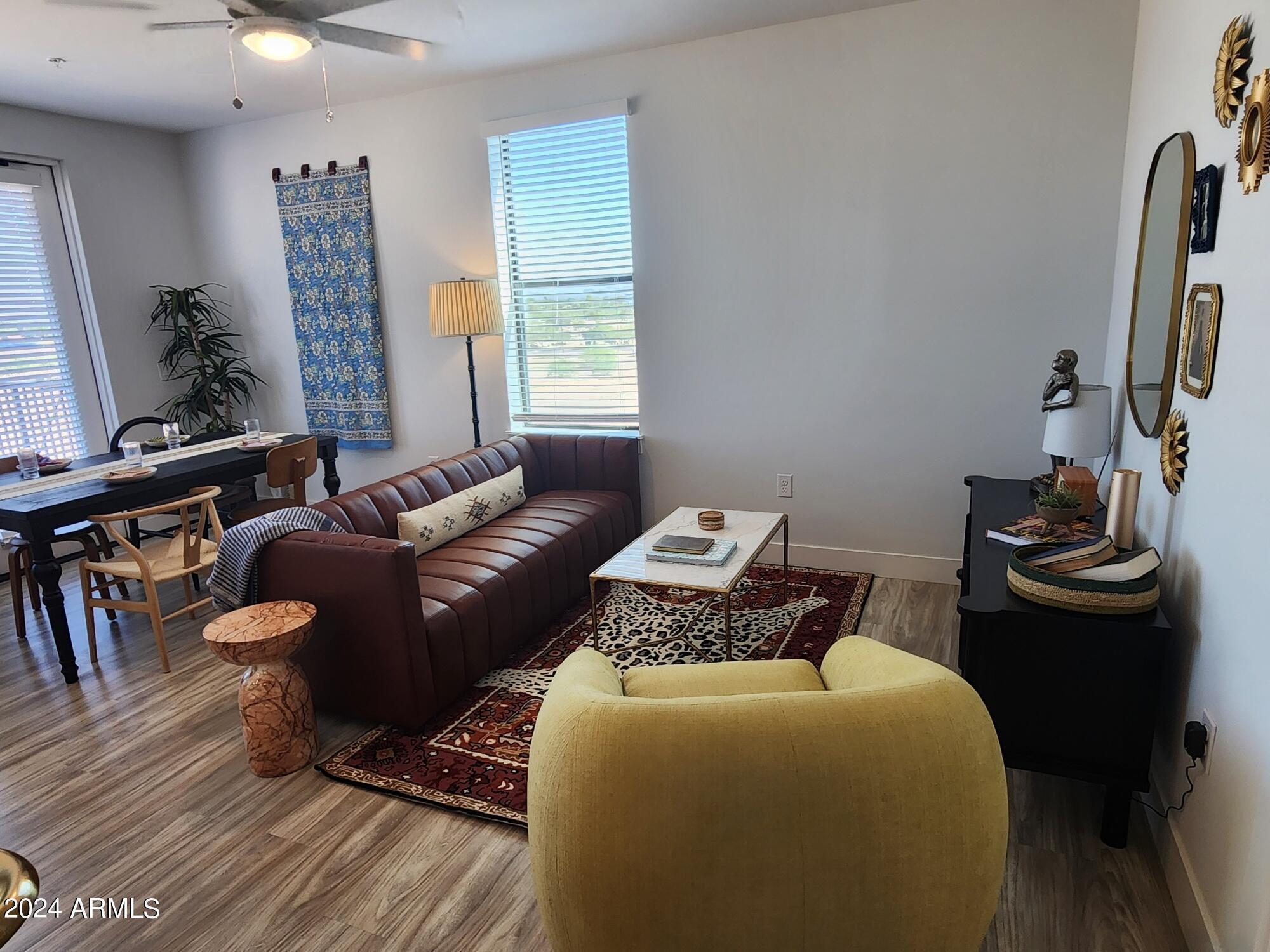 1727 East Pecos Road, Unit B4 Gilbert, AZ 85295 - Photo 3 of 6 a bedroom with furniture and a window