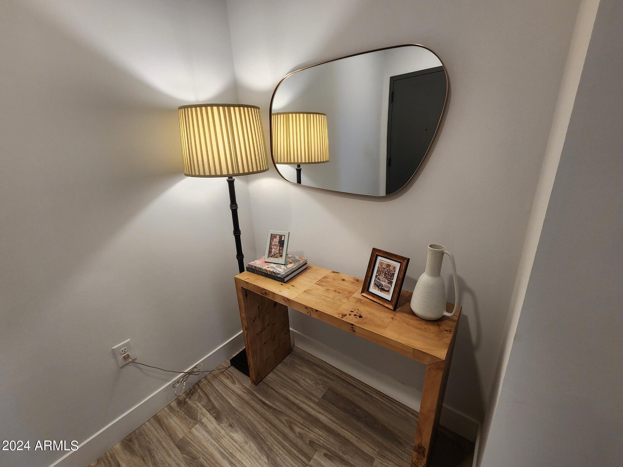 1727 East Pecos Road, Unit B4 Gilbert, AZ 85295 - Photo 4 of 6 a bathroom with a sink a mirror and vanity