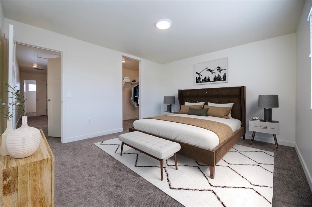 12603 Telge Road, Unit 7D Cypress, TX 77429 - Photo 5 of 19 a bedroom with a bed and wooden floor