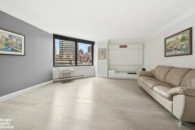 a living room with furniture and window