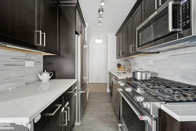 a kitchen with a stove and a sink