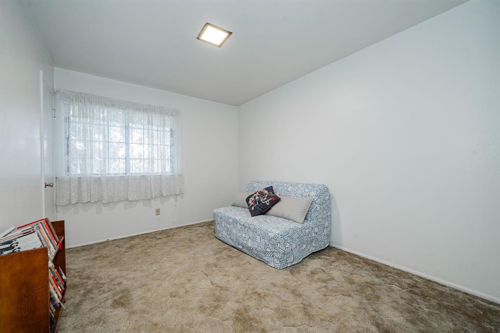 1759 Gross Road Dallas, TX 75228 - Photo 24 of 38 a living room with furniture and a window