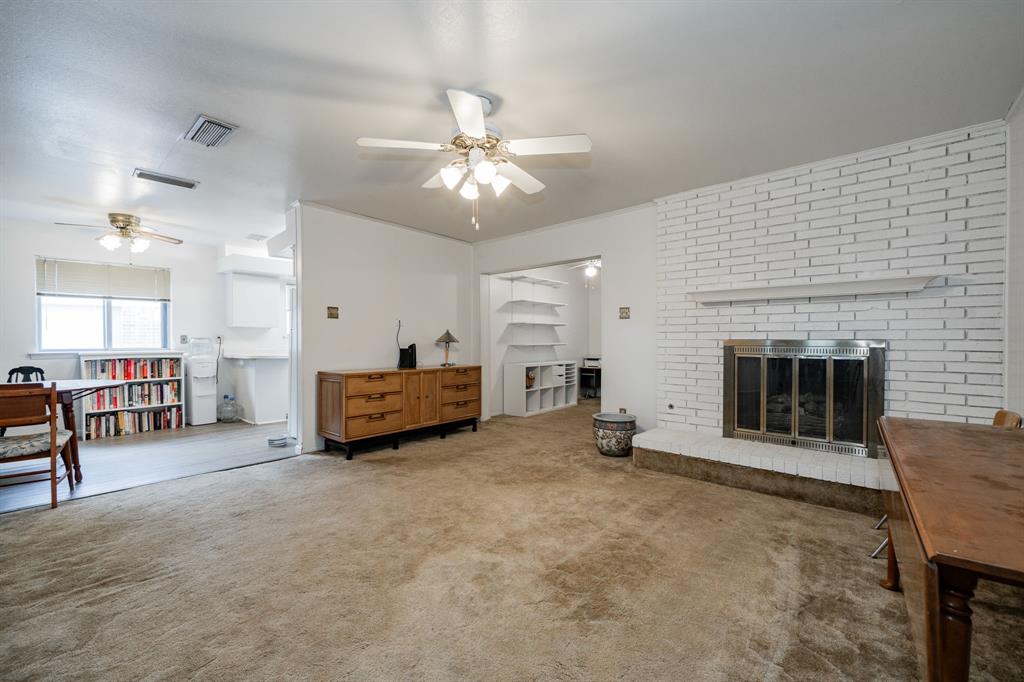 1759 Gross Road Dallas, TX 75228 - Photo 4 of 38 a living room with furniture and a fireplace