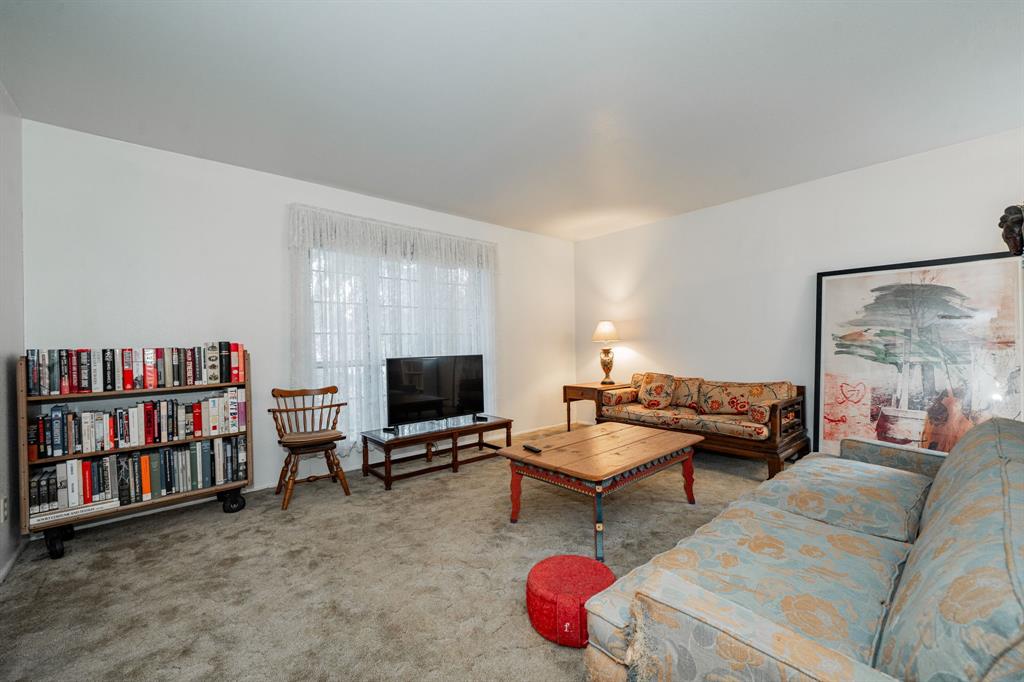 1759 Gross Road Dallas, TX 75228 - Photo 7 of 38 a living room with furniture and a flat screen tv