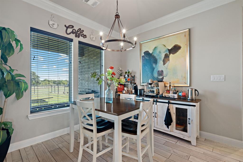 3032 Perkins Weatherford, TX 76088 - Photo 15 of 40 a view of a dining room with furniture window and wooden floor