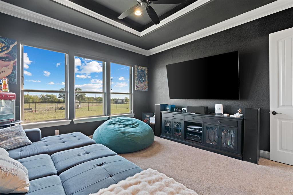 3032 Perkins Weatherford, TX 76088 - Photo 22 of 40 a living room with furniture and a flat screen tv