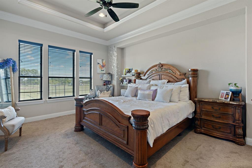 3032 Perkins Weatherford, TX 76088 - Photo 26 of 40 a bedroom with a bed and a dresser next to a window