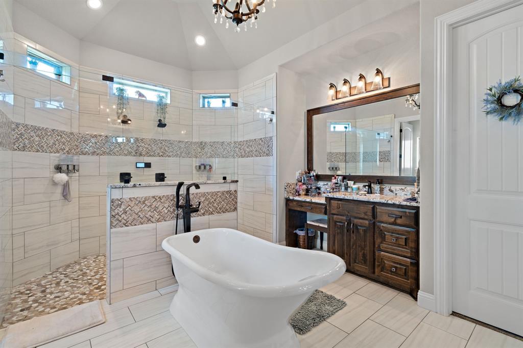 3032 Perkins Weatherford, TX 76088 - Photo 28 of 40 a bathroom with a sink a vanity a mirror and a toilet