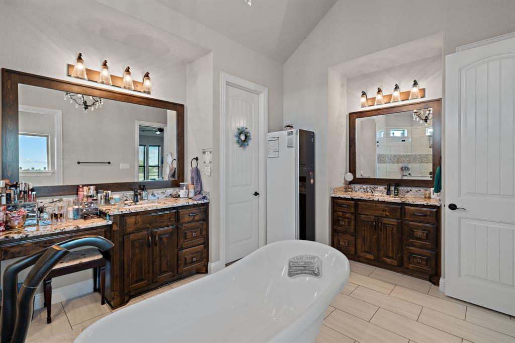3032 Perkins Weatherford, TX 76088 - Photo 30 of 40 a spacious bathroom with a sink double vanity and a mirror