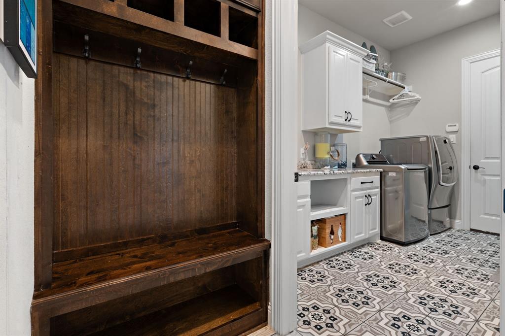 3032 Perkins Weatherford, TX 76088 - Photo 37 of 40 a room with cabinets and wooden floor