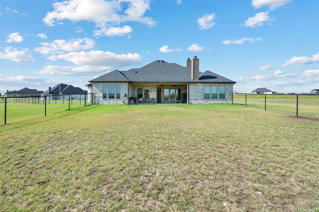 3032 Perkins Weatherford, TX 76088 - Photo 39 of 40 a view of a house with a yard and a large tree