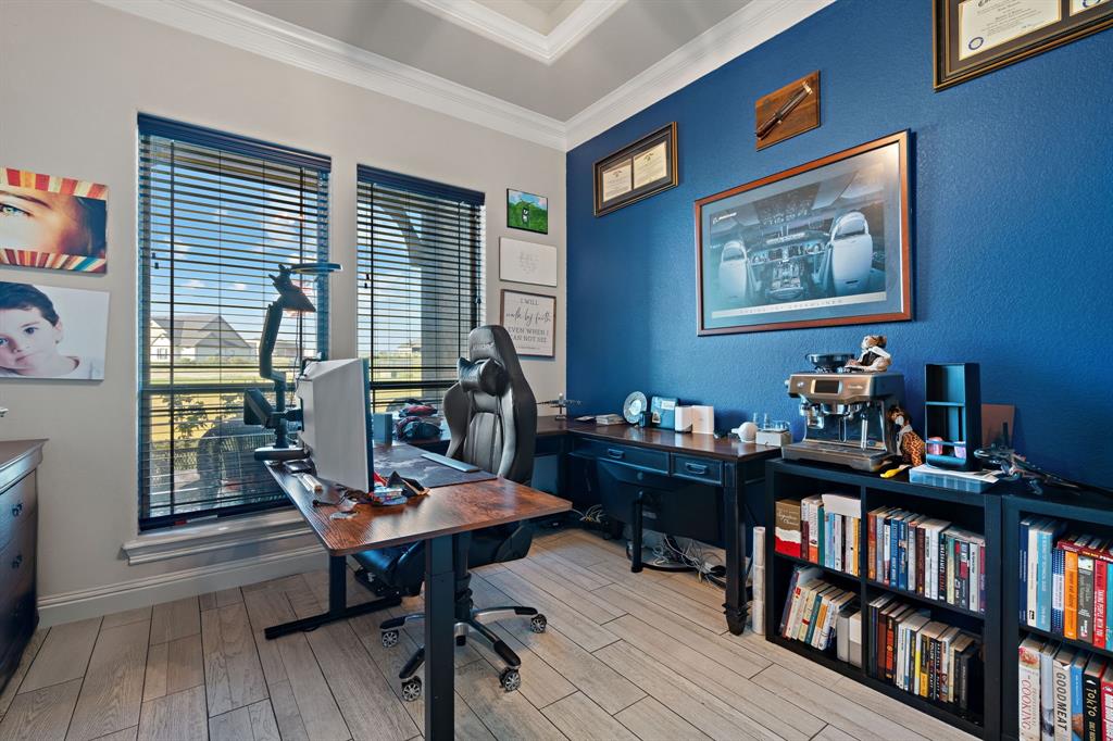 3032 Perkins Weatherford, TX 76088 - Photo 6 of 40 a view of a workspace with furniture and a book shelf