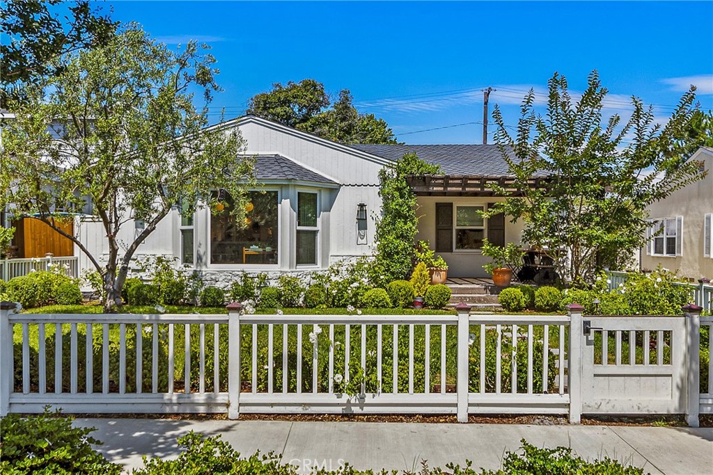 front view of a house with a garden