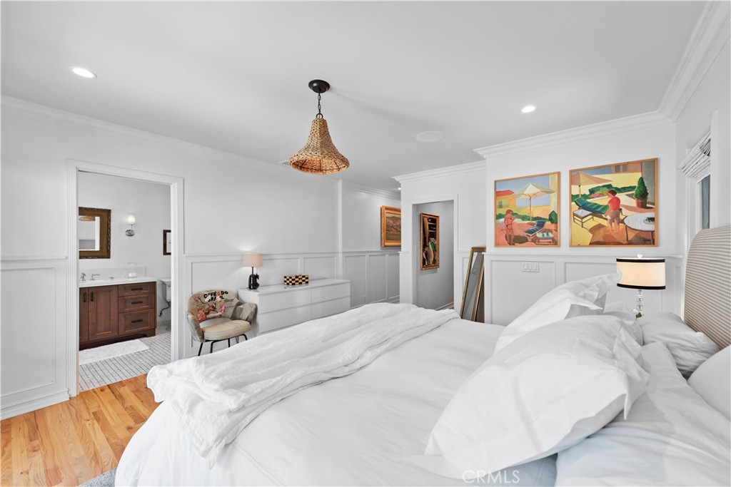 320 Broadway Costa Mesa, CA 92627 - Photo 12 of 53 a bedroom with a bed and glass windows