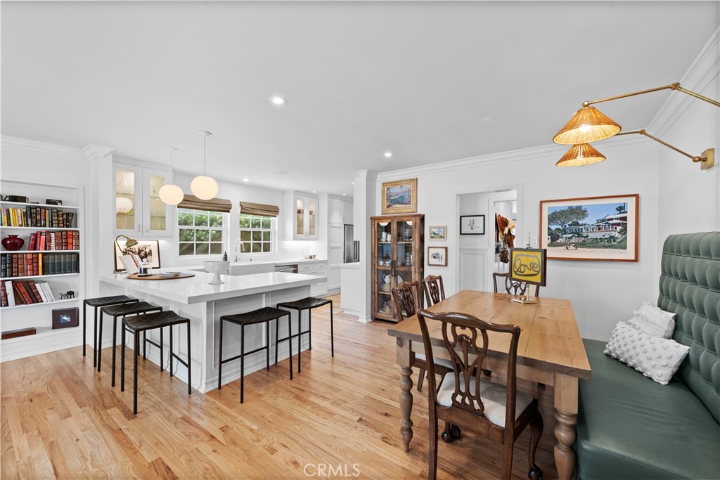 320 Broadway Costa Mesa, CA 92627 - Photo 22 of 53 a view of a dining room with furniture and wooden floor