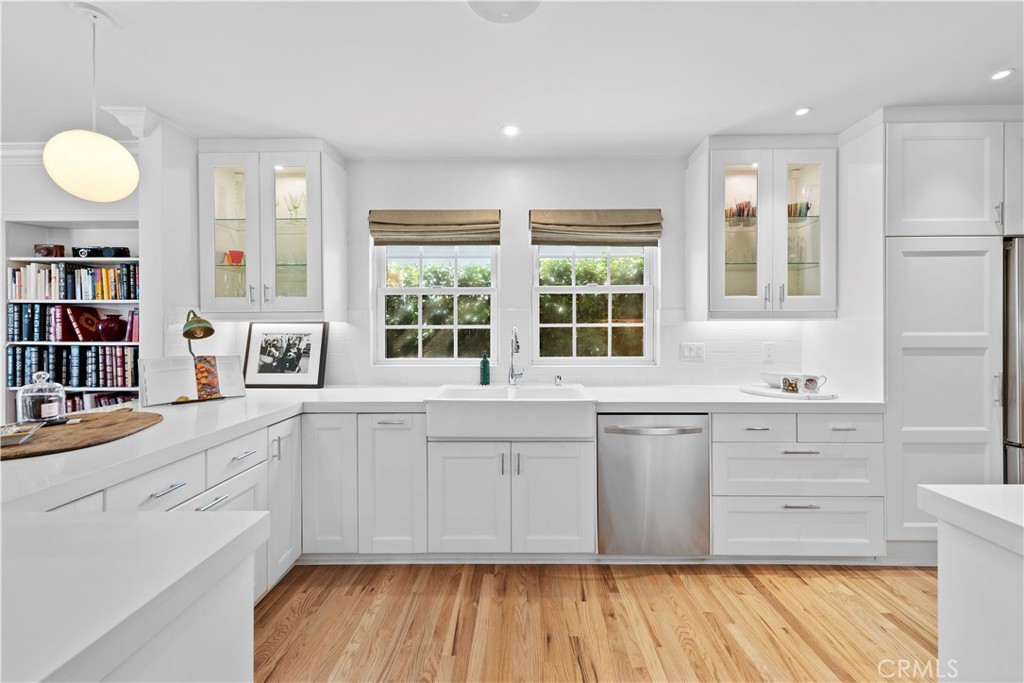 320 Broadway Costa Mesa, CA 92627 - Photo 26 of 53 a large kitchen with wooden cabinets and a large window