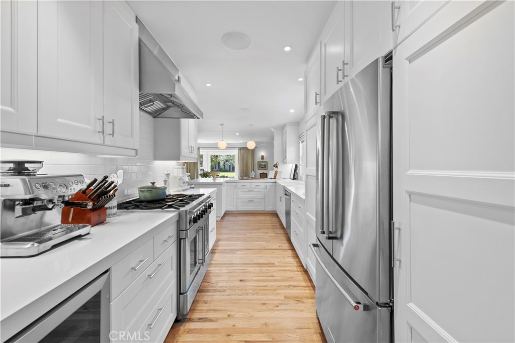 320 Broadway Costa Mesa, CA 92627 - Photo 27 of 53 a kitchen with stainless steel appliances granite countertop lots of counter top space and cabinets