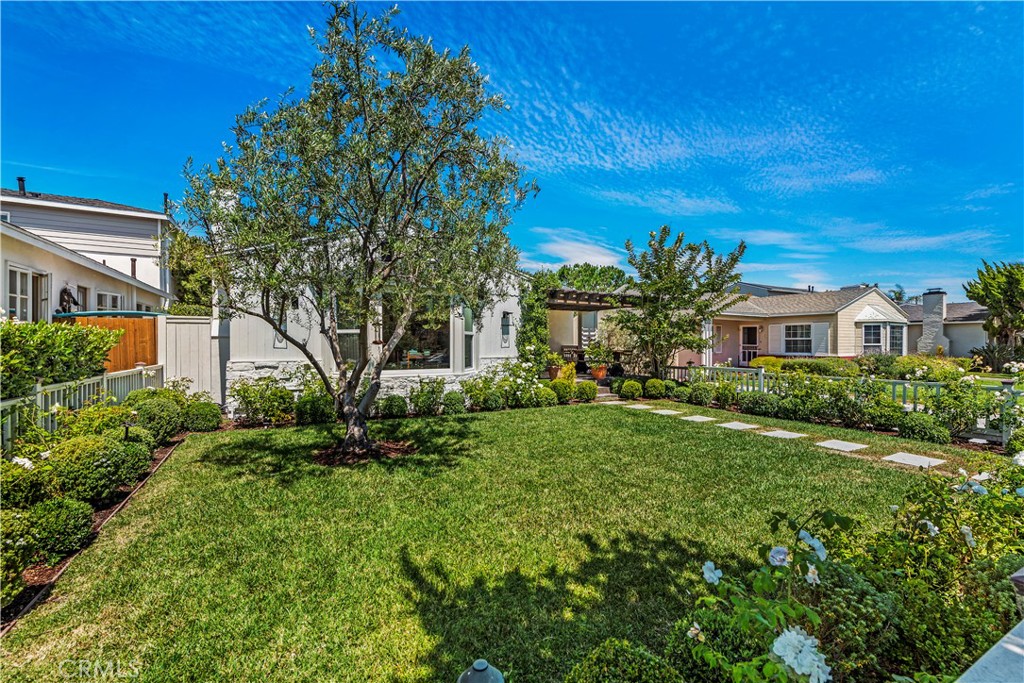 320 Broadway Costa Mesa, CA 92627 - Photo 3 of 53 a front view of a house with a yard