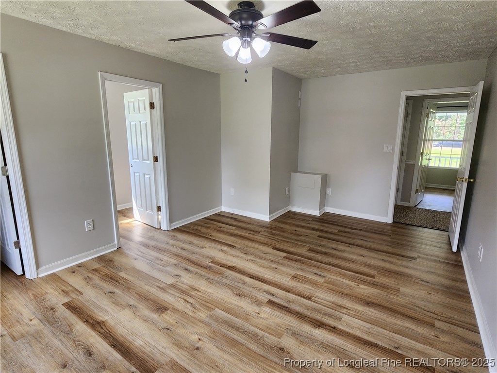 5444 Rockfish Road Raeford, NC 28376 - Photo 15 of 37 wooden floor in an empty room with a window