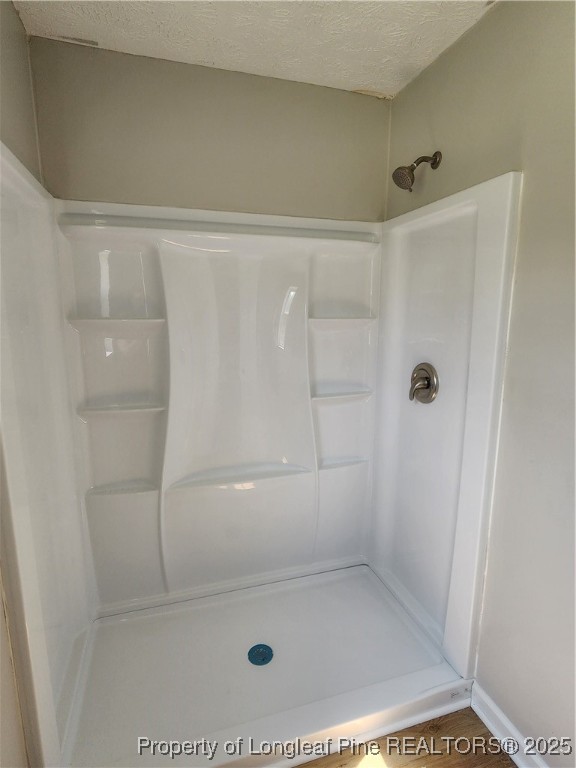 5444 Rockfish Road Raeford, NC 28376 - Photo 18 of 37 a bathroom with a shower