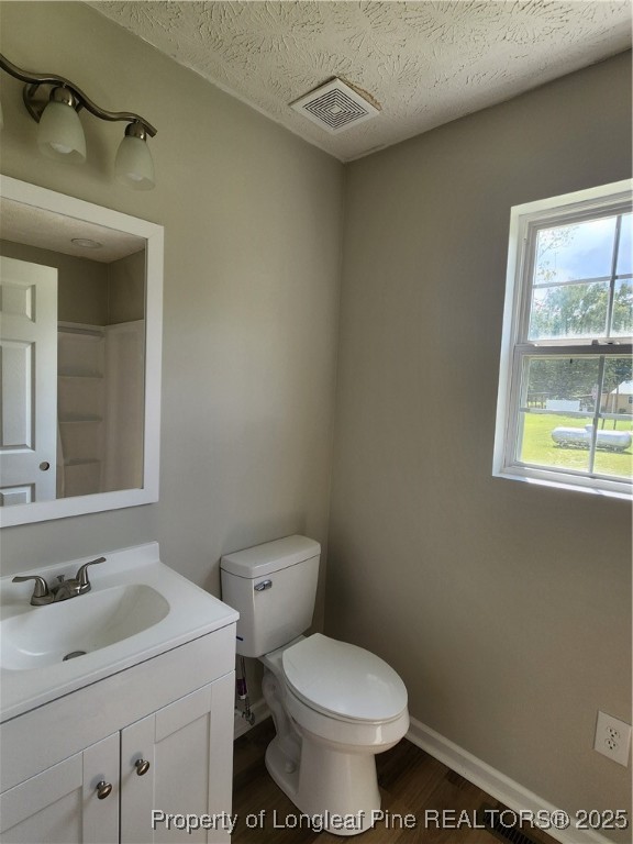 5444 Rockfish Road Raeford, NC 28376 - Photo 19 of 37 a bathroom with a sink toilet and window