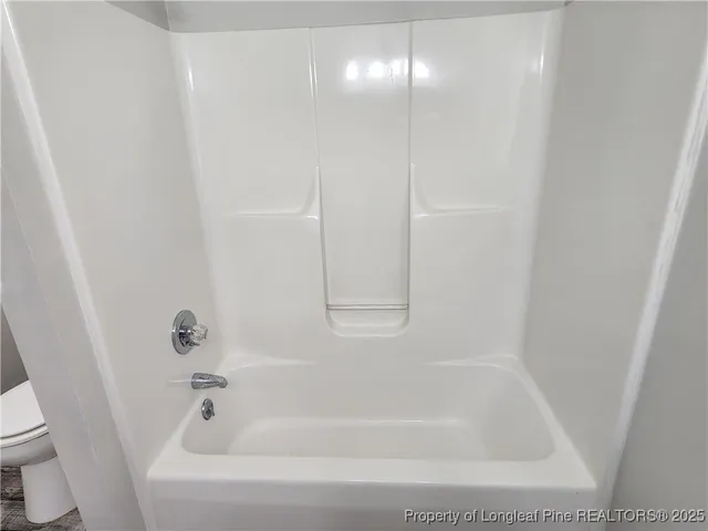 a close view of a bathtub in bathroom