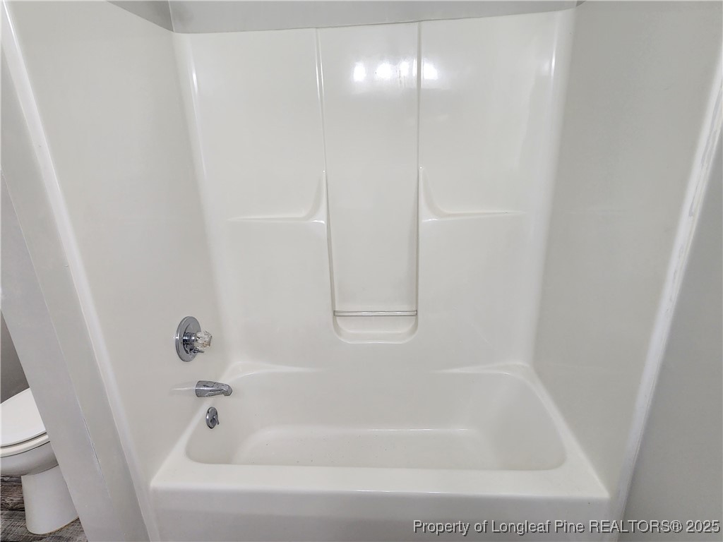 5444 Rockfish Road Raeford, NC 28376 - Photo 25 of 37 a close view of a bathtub in bathroom