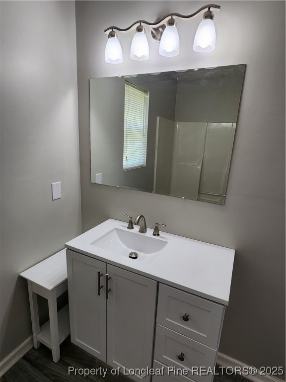 5444 Rockfish Road Raeford, NC 28376 - Photo 27 of 37 a bathroom with a sink and a mirror