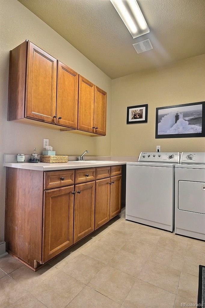 17874 West 77th Lane Arvada, CO 80007 - Photo 18 of 33 a view of a kitchen with electric appliances