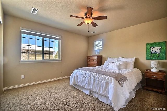 a bedroom with bed and window