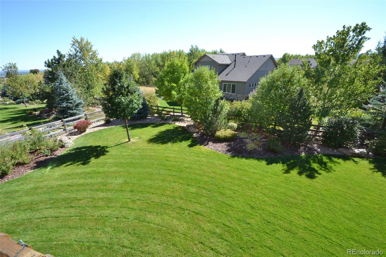 17874 West 77th Lane Arvada, CO 80007 - Photo 7 of 33 a view of an outdoor space and a yard