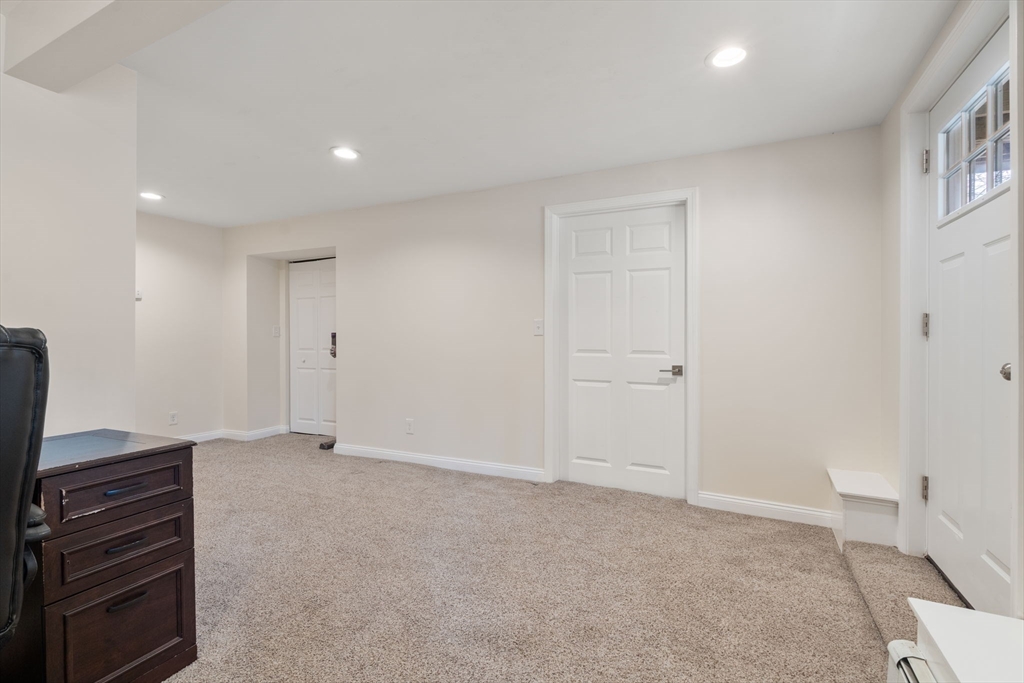 518 Maple Street Danvers, MA 01923 - Photo 13 of 20 a view of an empty room with wooden floor