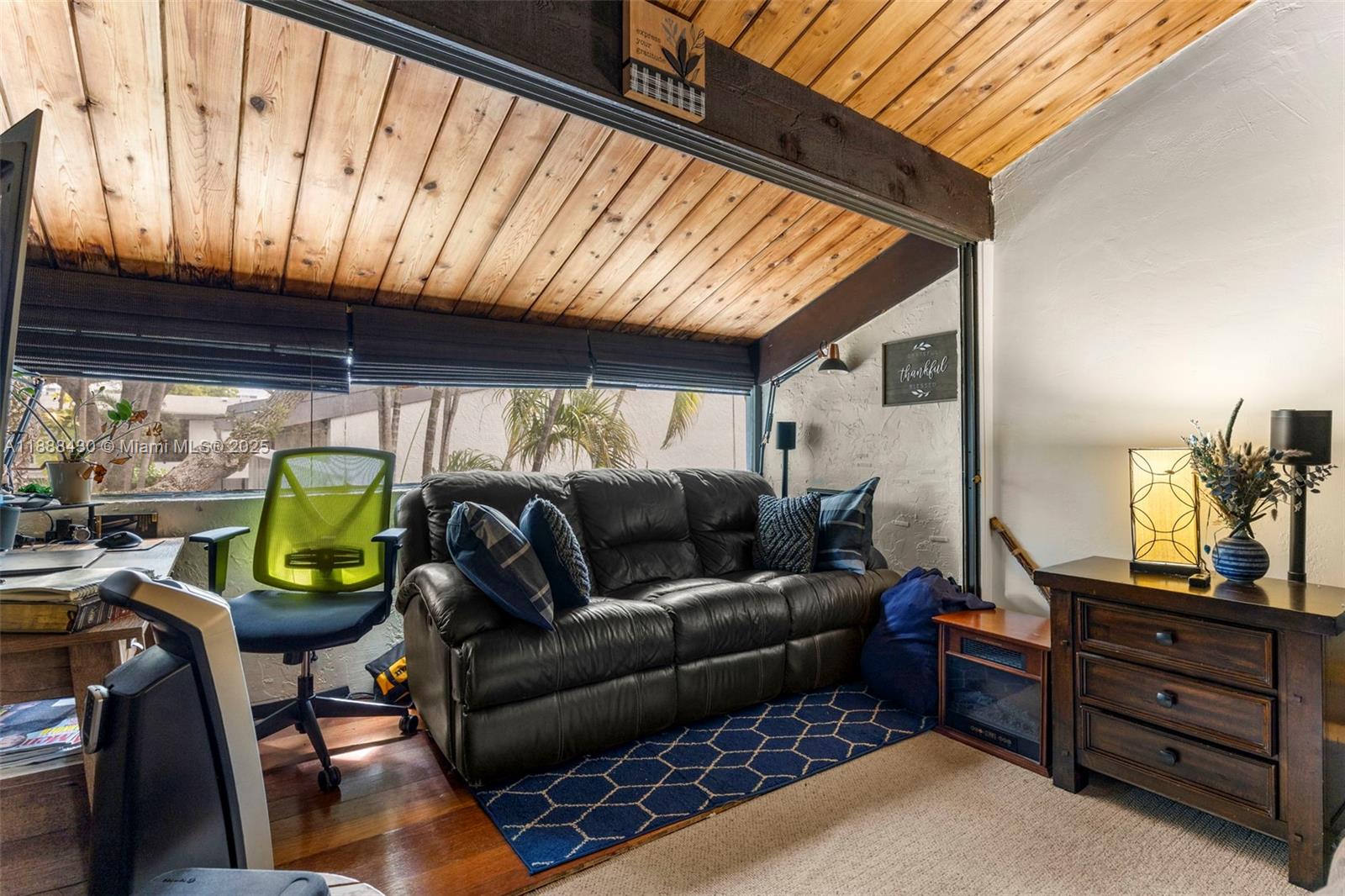 19440 Northeast 26th Avenue, Unit 53B Miami, FL 33180 - Photo 15 of 33 a bedroom with furniture and a window