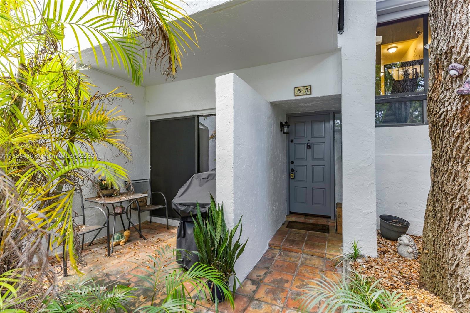 19440 Northeast 26th Avenue, Unit 53B Miami, FL 33180 - Photo 25 of 33 a view of entryway and hall with wooden floor