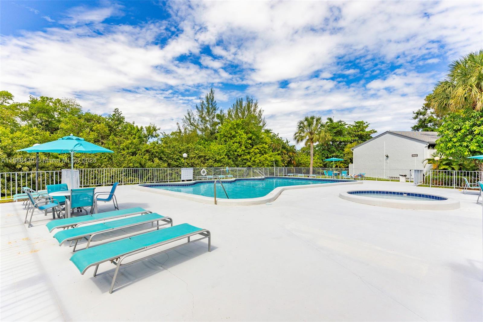 19440 Northeast 26th Avenue, Unit 53B Miami, FL 33180 - Photo 27 of 33 swimming pool view with seating space